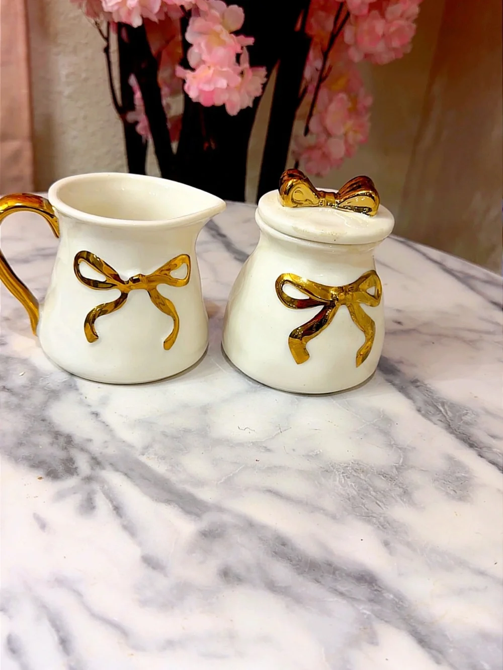 Cream Ceramic Creamer and Sugar Set with Gold Bow Accents